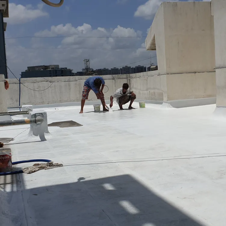 Employees performing terrace waterproofing